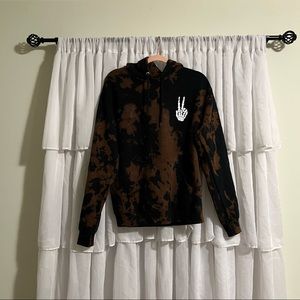 Bleached hoodie with skull hand.